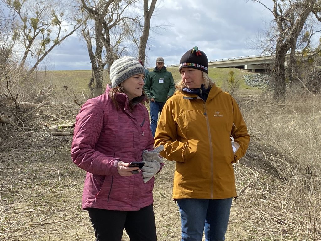 Lead staff from the Natural Resources Conservation Service (NRCS), Timmie Mandish and Jennifer Cavanaugh, discuss the project on Field Day.  NRCS provides half of the funding for the project.